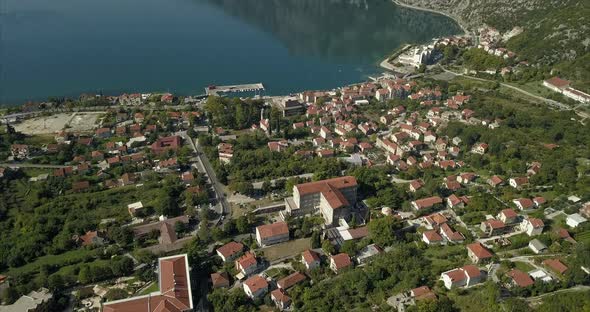 aerial shot of Risan in Montenegro panning up to show the Bay of Kotor and the mountains that surrou