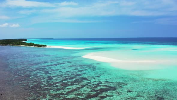 Aerial drone abstract of tranquil seashore beach adventure by blue water with white sand background 