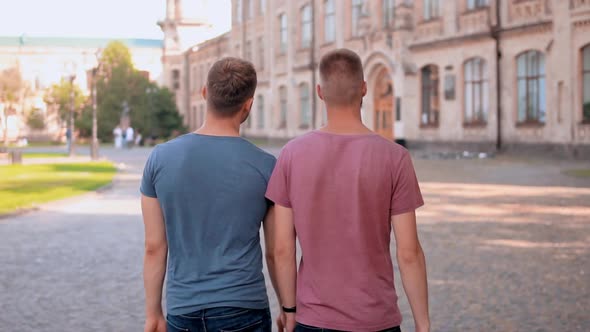 Caucasian Young Men Wearing Casual T-shirt Stroll in Campus Area