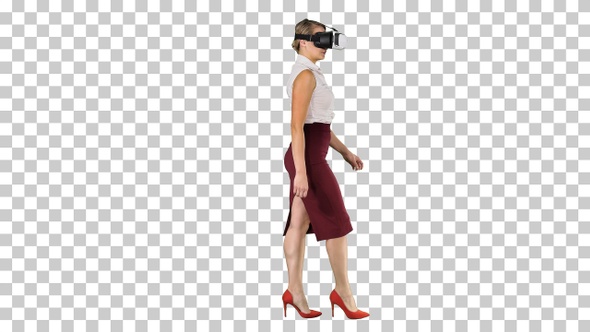 Young woman wearing virtual reality device and walking