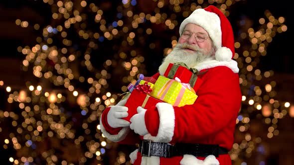 Cheerful Santa Holding Presents