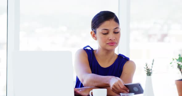 woman calling on smartphone in office