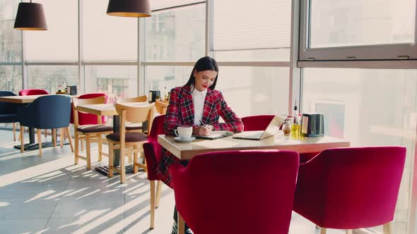 Stylish Business Woman Is Working In Cafe