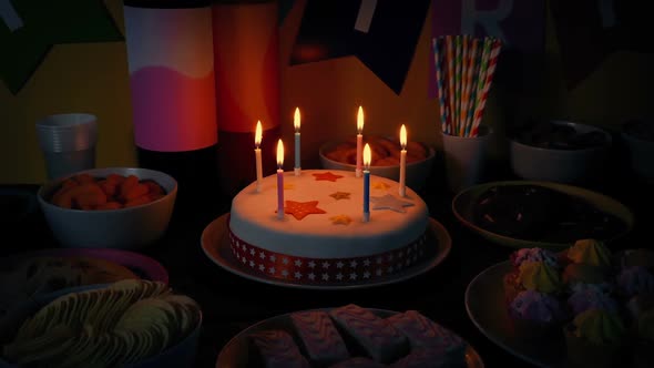 Rotate Around Birthday Cake In Dark Room With Snack Foods