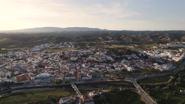 Rotating aerial over the city of Silves and the nearby Arade river