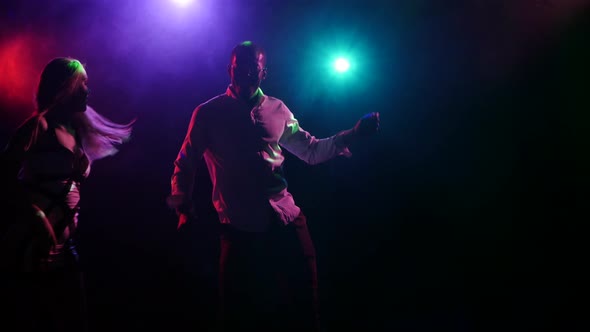 Sexy Couple Dancing Latin American Dance at Disco Party