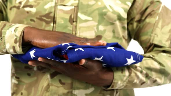 Portrait of military soldier holding US flag