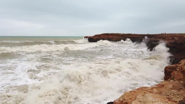 Rough Sea And Large Waves Lash Rugged Coastline