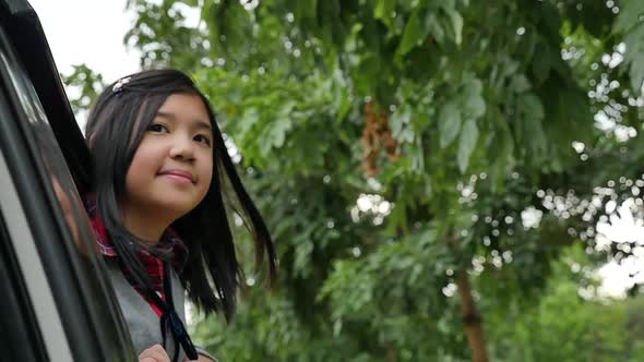 Happy Asian Girl Travels By Car