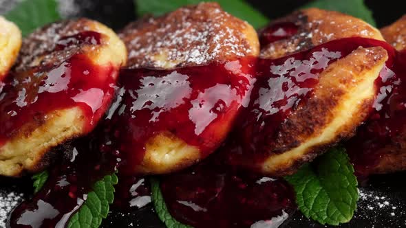 cottage cheese pancakes with raspberry jam and sugar powder