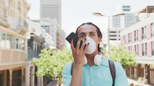 Man with a coronavirus mask talking on the phone