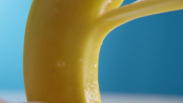 Macro Lens Shot Fresh Banana Gets Peeling on a Blue Background