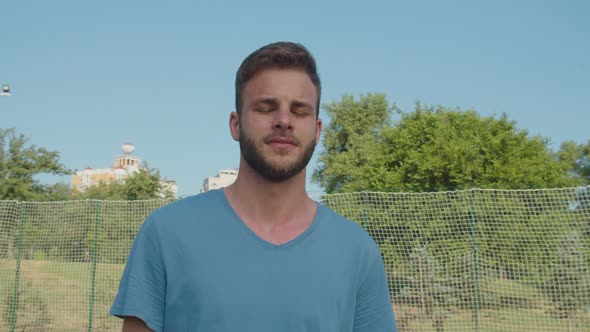 Portrait of Handsome Young Adult Bearded Male Sportsman Outdoors