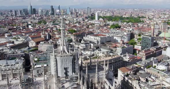 Top drone view of restoration at historic Milan Cathedral, Italy