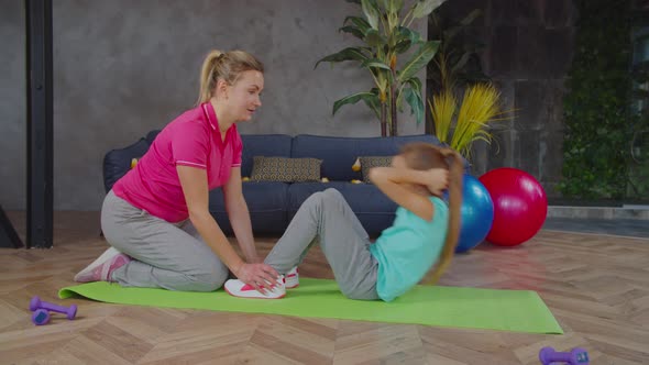 Preadolescent Girl Training with Mother at Home