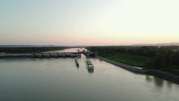 A cruise ship navigating out of a lock on the Danube in Austria.