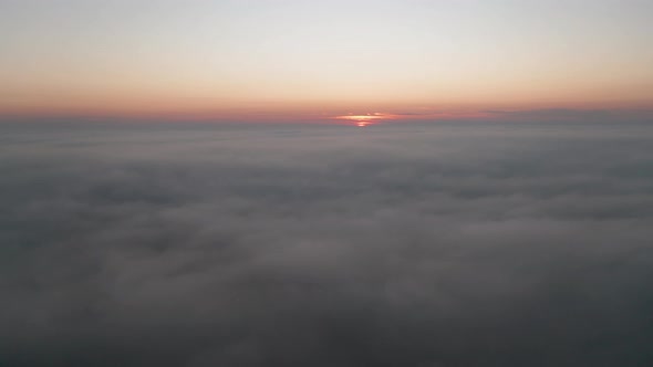 Video over а morning calm sea with low clouds alt