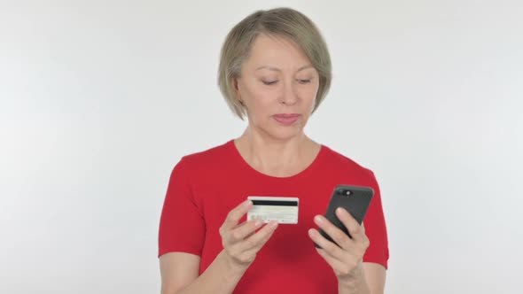 Successful Online Shopping on Smartphone By Old Woman on White Background