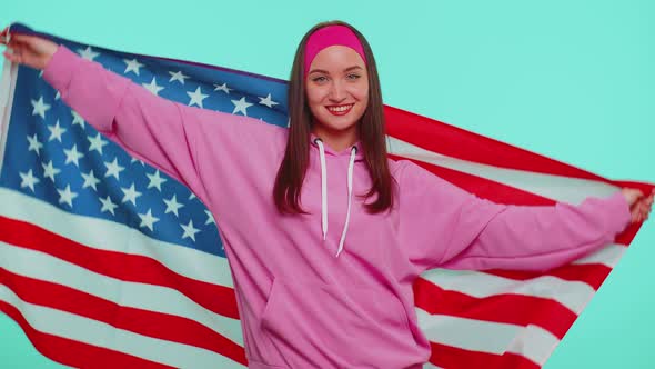 Cheerful Teen Girl Waving and Wrapping in American USA Flag Celebrating Human Rights and Freedoms