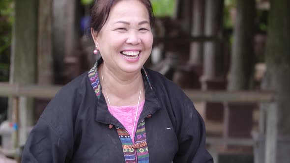 Happy Asian Woman Threshed Rice