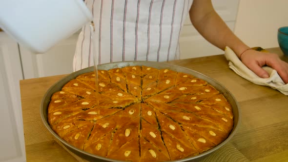 A Woman is Preparing Baklava in the Kitchen