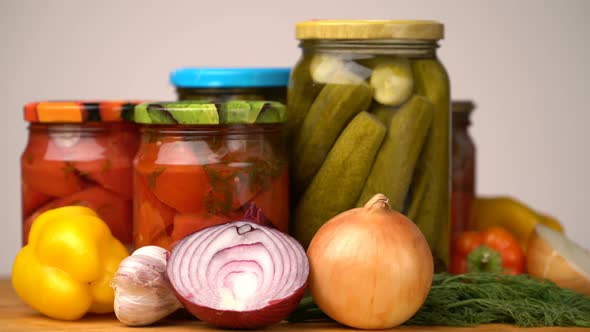 Footage Glass Jars with Salted Vegetables for the Winter Rotated on Table