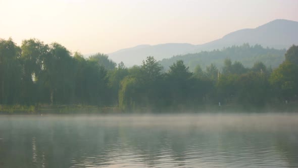 Foggy Morning Over Mountain Lake