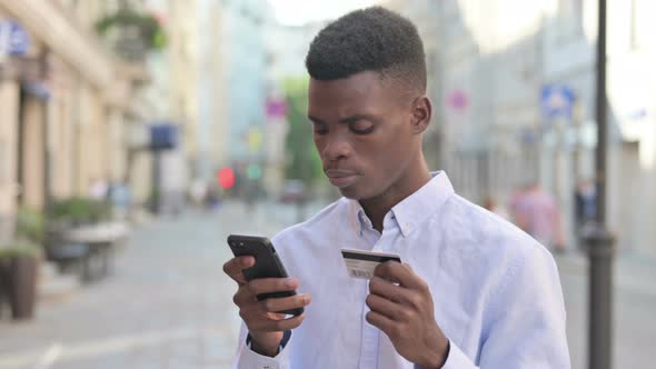 African Man Having Online Payment Failure on Smartphone