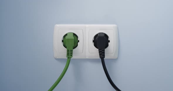 Inserting Green Power Plug Electricity Socket Concept Of Development Renewable Energy Global Warming