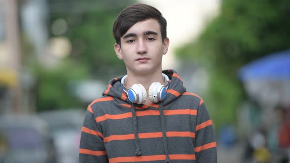 Young Handsome Iranian Teenage Boy in the Streets Outdoors