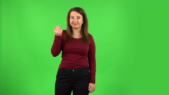 Pretty Girl Waving Hand and Showing Gesture Come Here. Green Screen