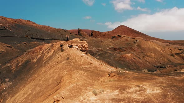 Woman in Sportswear Runs Along the Endless Desert Sandy Hills