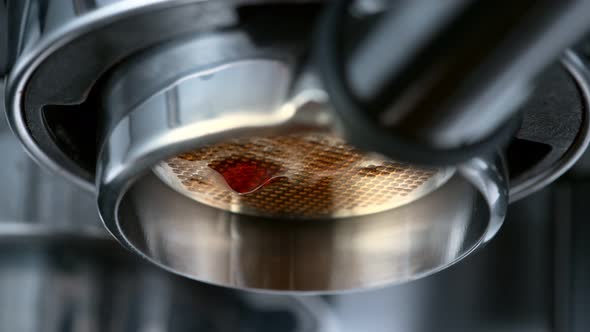 Super Slow Motion Macro Shot of Dripping Fresh Espresso Coffee From Lever Machine at 1000 Fps
