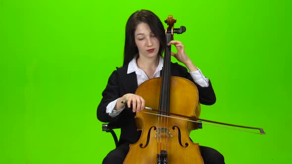 Girl Sits and Plays the Cello