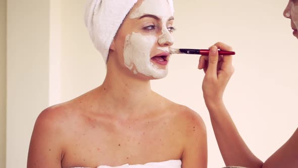 Beautiful Woman Having a Facial Treatment at Spa