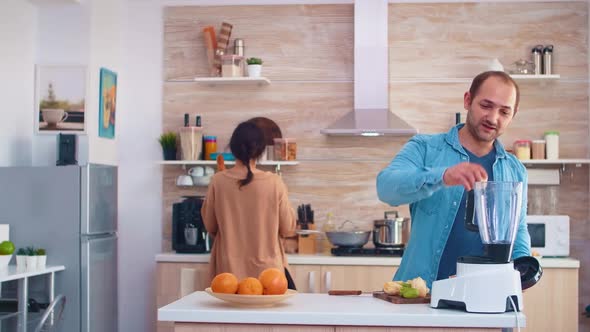 Man Mixing Fruits for Smoothie