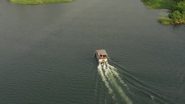 cruise boat with people on river_1