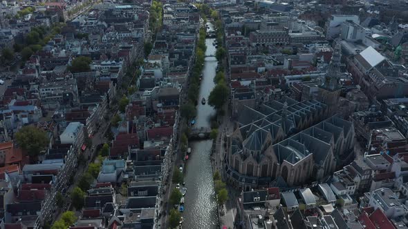 Birds View of Amsterdam Canal River with Boat Traffic and Old Cathedral