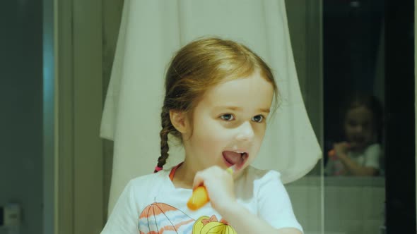 Healthy Teeth From Early Childhood, a Small Child Cleans His Teeth