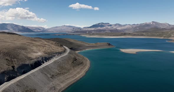 Backward aerial view of the maule lagoon at the pehuenche border crossing between chile and argentin