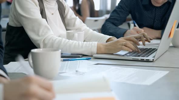 Woman Working on Laptop Computer Indoor Coworking Space