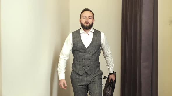 Stylish Young Man In Clothing Store Posing In New Suit.