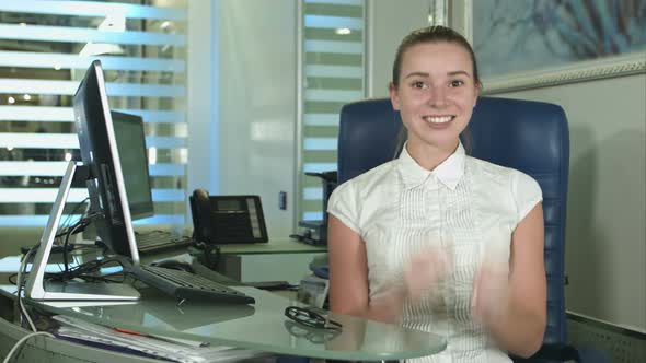 Cheerful Office-worker Showing Thumbs Up Looking at Camera