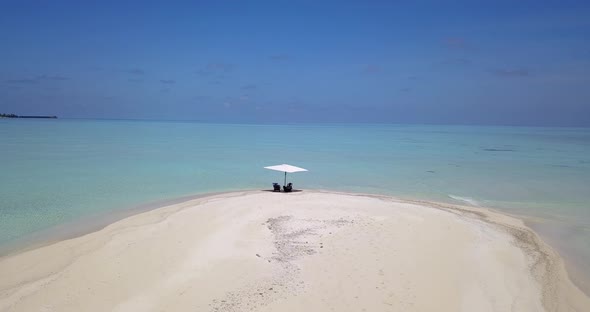 Happy couple on honeymoon vacation spend quality time on beach on sunny white sandy 4K background