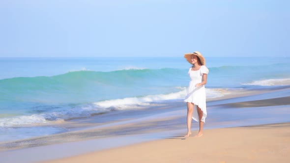 Asian woman enjoy around beautiful beach sea ocean
