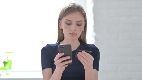 Portrait of Woman Making Online Payment on Smartphone