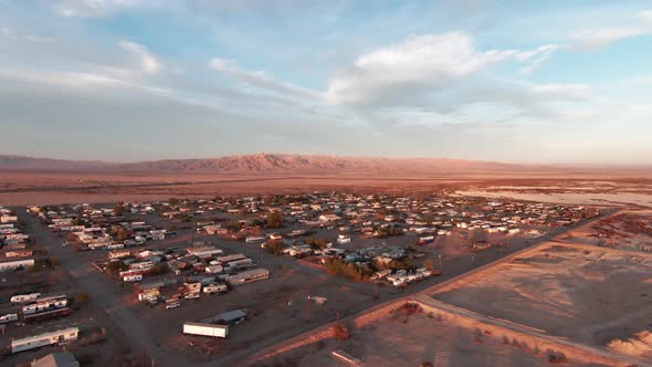 Small village full of trailers and prefabricated homes on Bombay Beach, Salton Sea, CA. Aerial drone