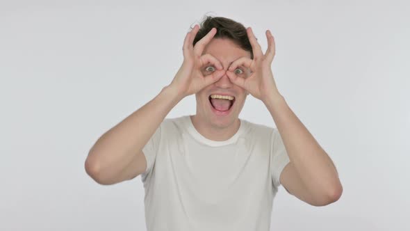 Funny Young Man with Binocular Gesture Searching on White Background