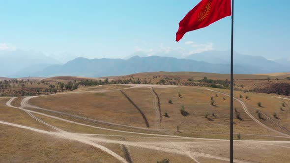 Aerial view flagpole with Kyrgyzstan flag