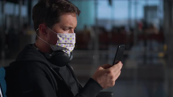 Man Taking Precautions and Wearing Medical Mask in Public